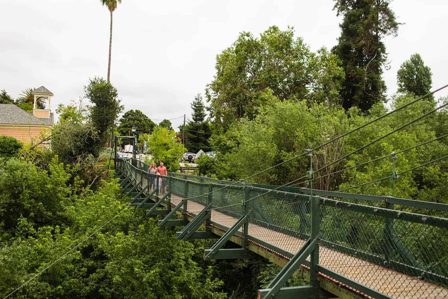 The Swinging Footbridge with the historic school house in the distance